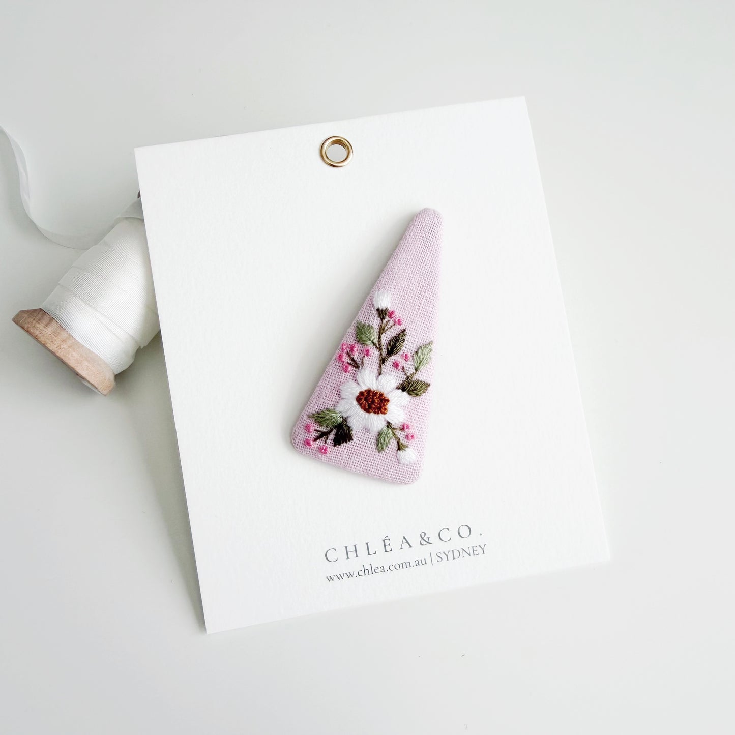 Embroidered Daisy On Pink Linen