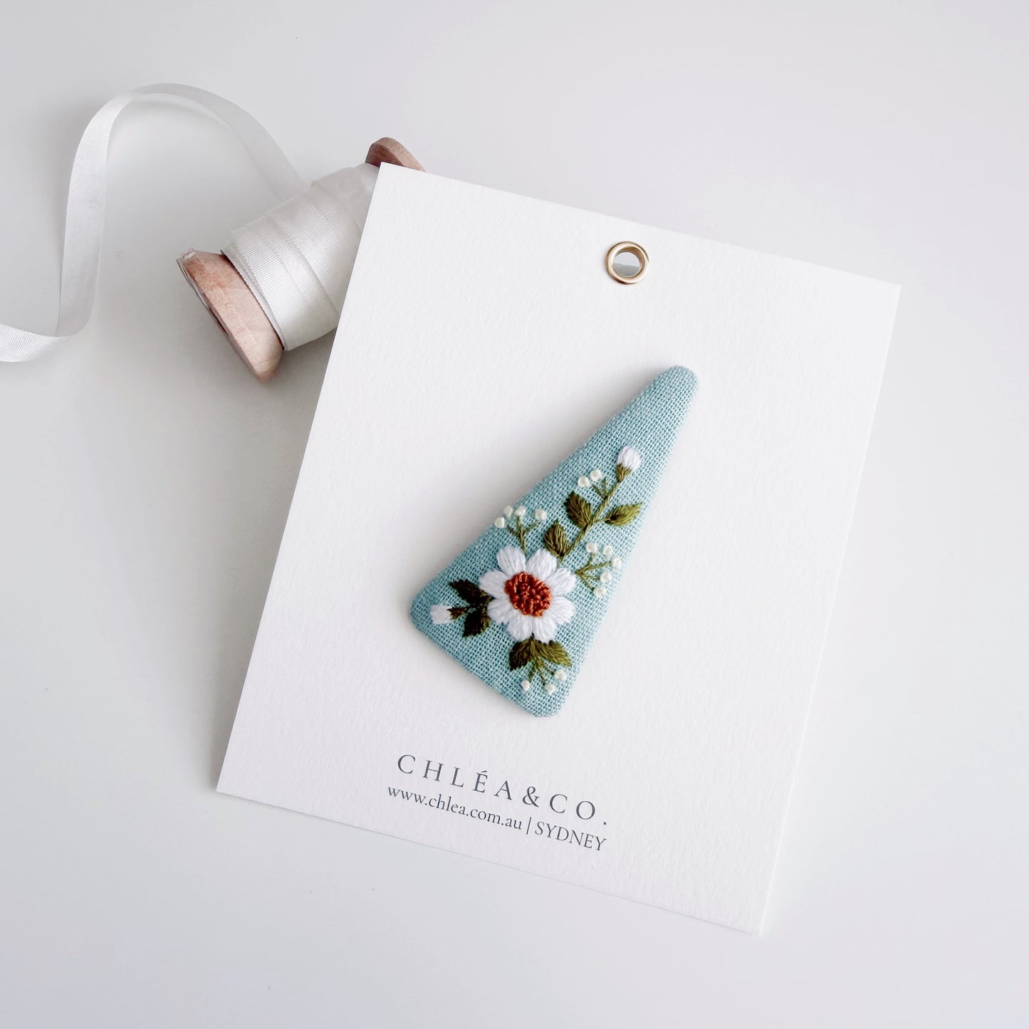 Embroidered Daisy On Powder Blue Linen