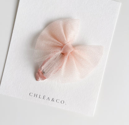 Aurora tulle snap clip in peach colour. Beautiful hair bow for everyday wear and special occasions such as wedding, flower girl, baptism, christening, birthday outfit and photoshoot. 