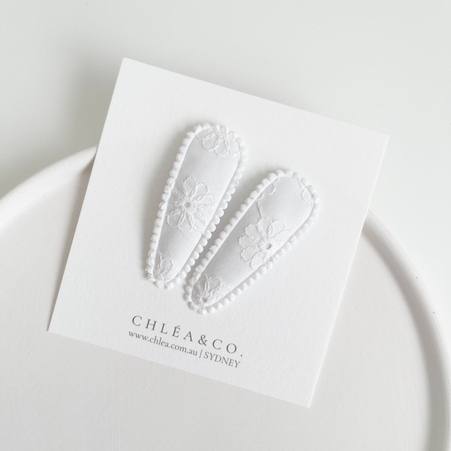 White Fleur Fabric Covered Snap Clip