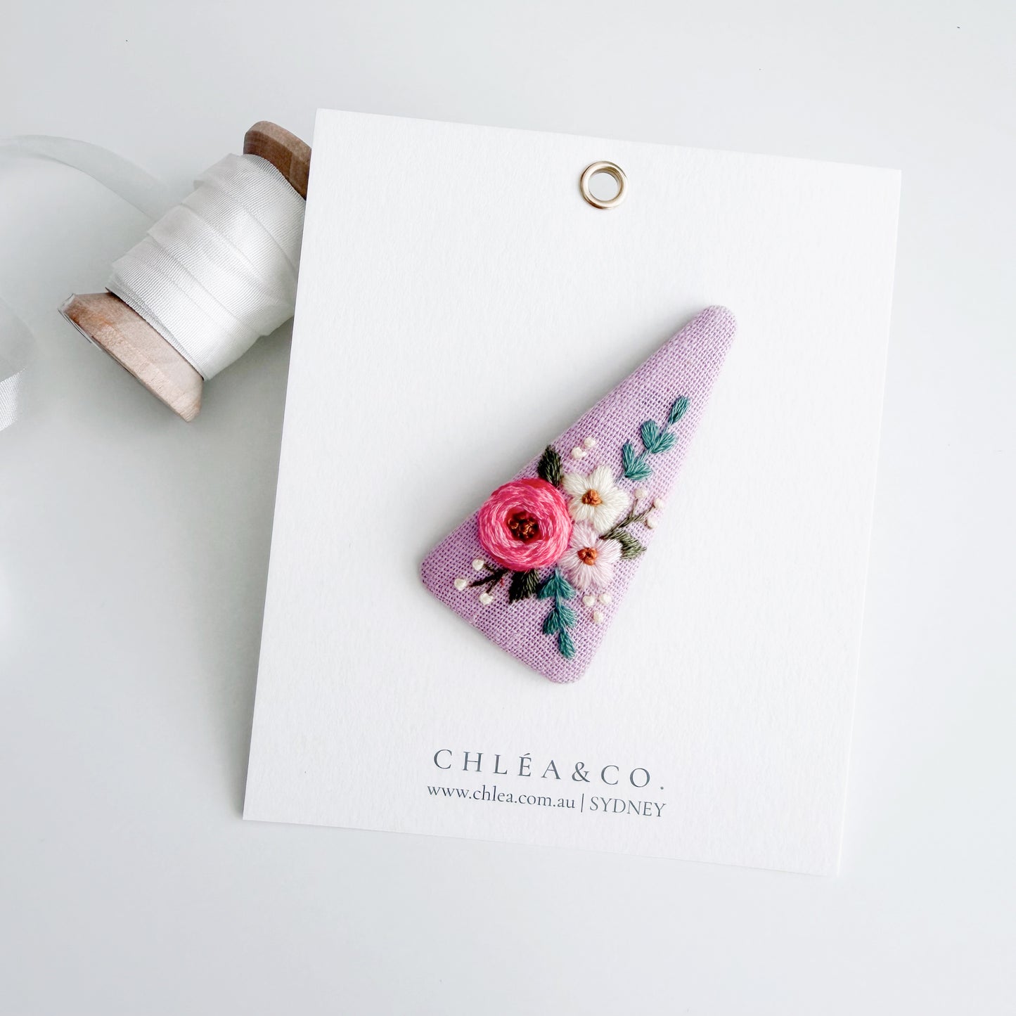 Embroidered Rose On Purple Linen