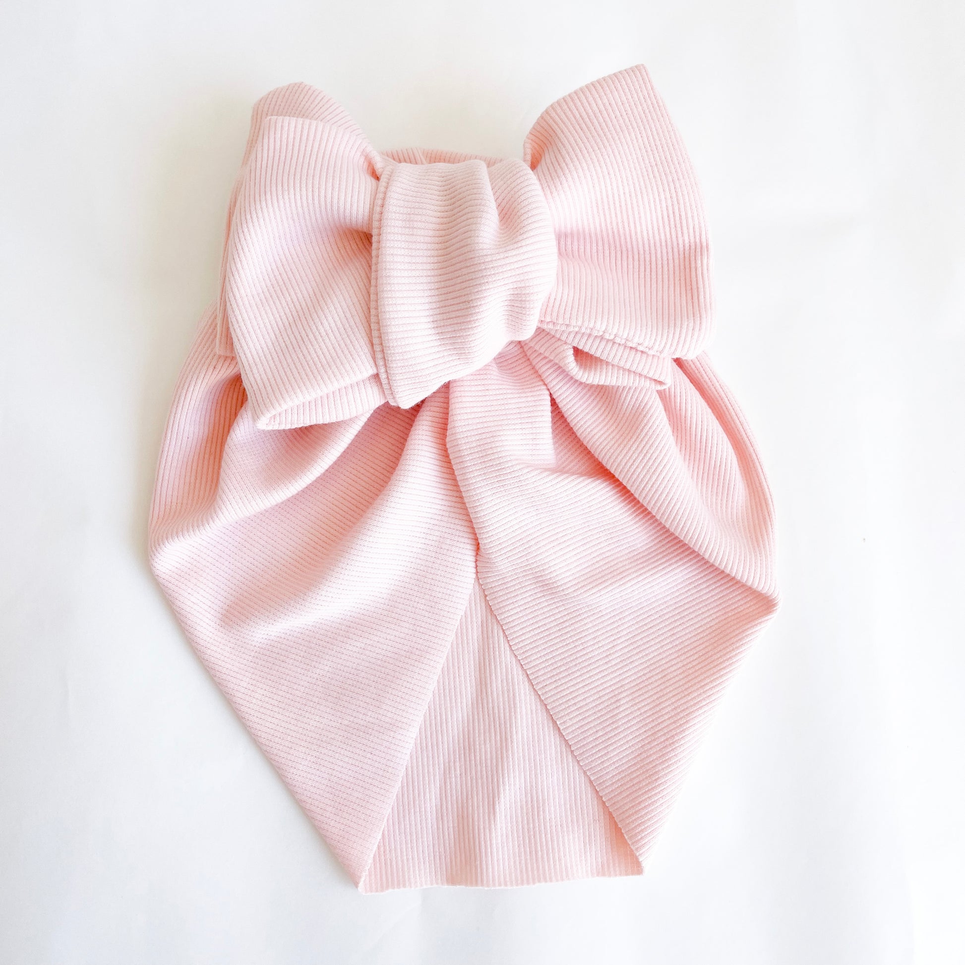 Pre-tied Baby Turban  available in pink colour. Beautiful hair bow for everyday wear and special occasions such as wedding, flower girl, baptism, christening, birthday outfit and photoshoot.