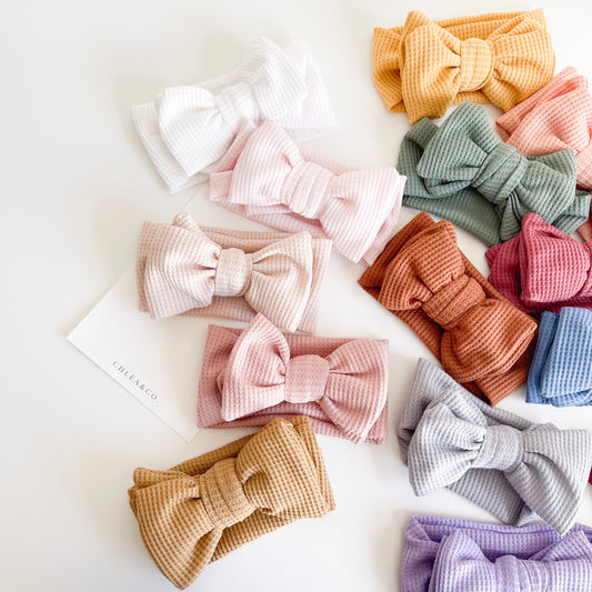 Waffle Bow Headband in 17 colours. Beautiful hair bow for everyday wear and special occasions such as wedding, flower girl, baptism, christening, birthday outfit and photoshoot.