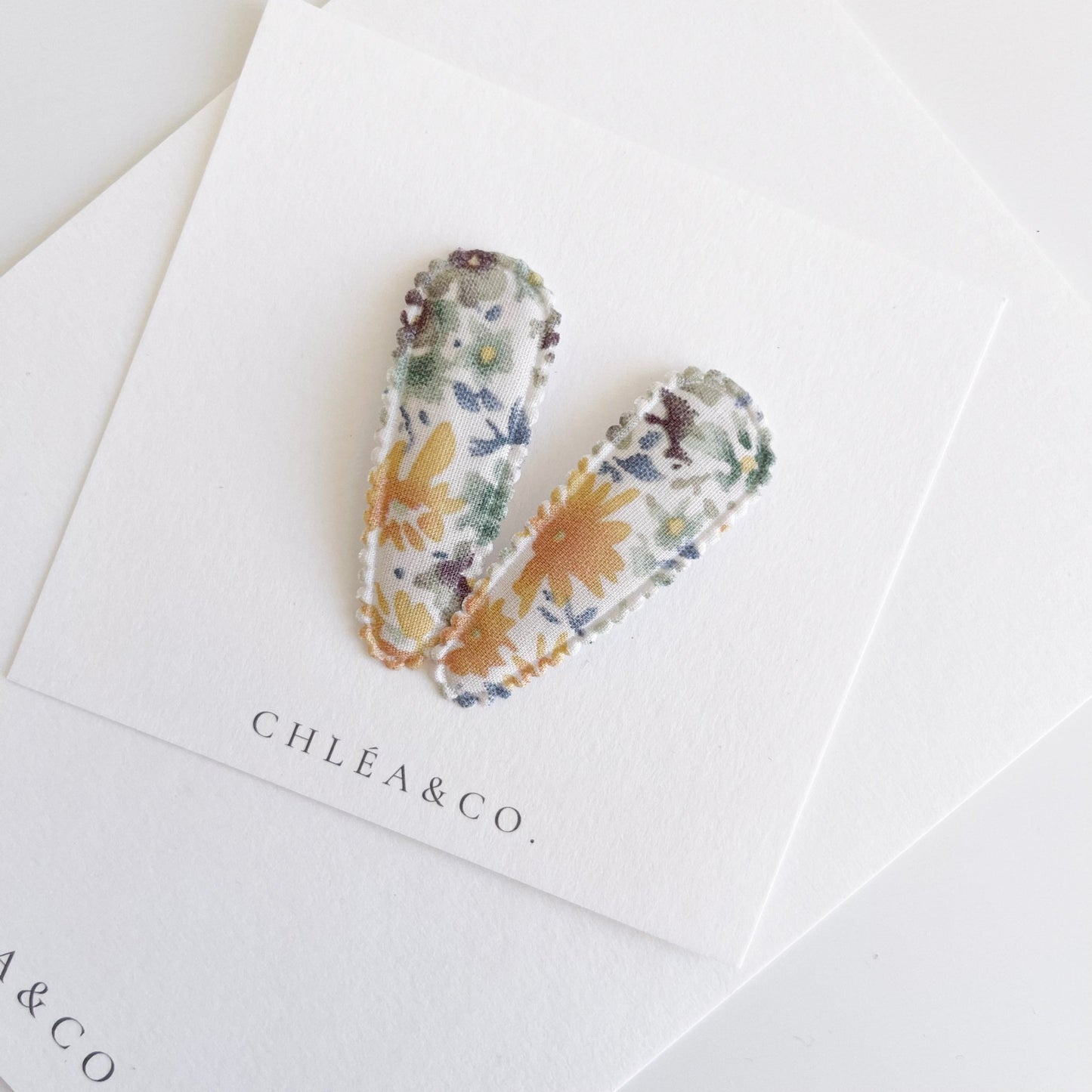 Gracelynn Fabric Covered Snap Clip - Chléa & Co.